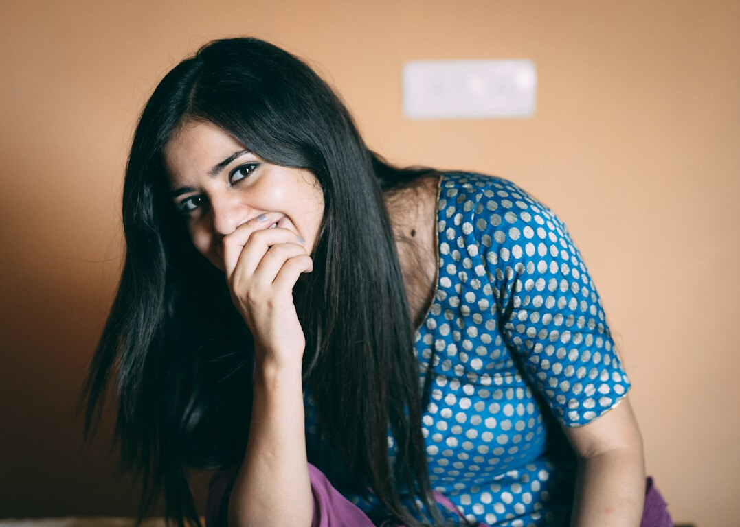 Portrait of a young woman with long hair smiling