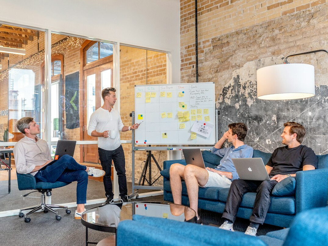 team discussing insurance tech